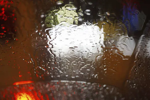 car drops with raindrops on a car. car wash in a car window