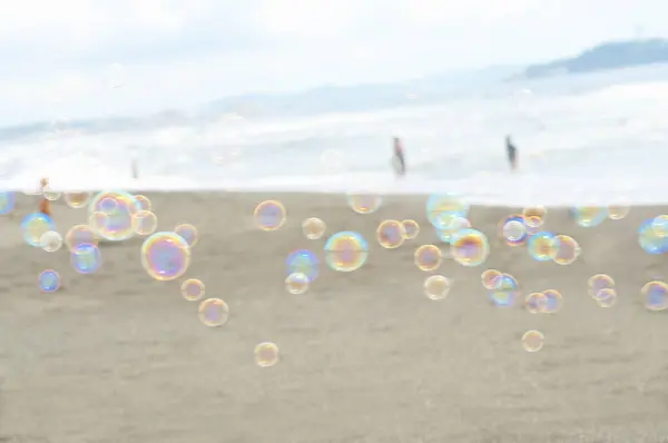 colorful bubbles in the sea on the beach