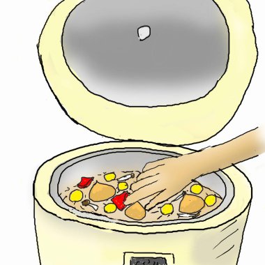 Elektrikli pilav fırınının içinde elle karıştırılan renkli malzemeler.