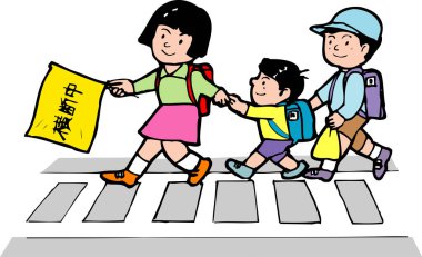 Çocuklar yaya geçidinde el ele yürüyorlar.