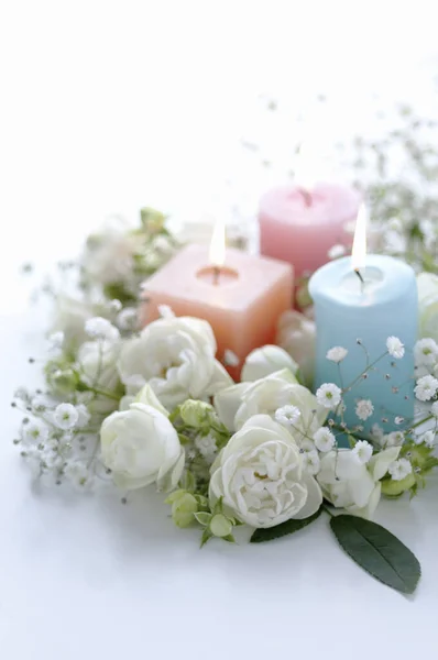 Close View Burning Candles Beautiful White Flowers Light Background — Stock Photo, Image