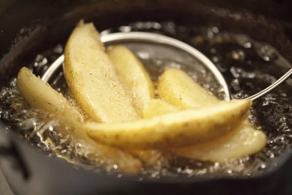 fried potato close up in oil