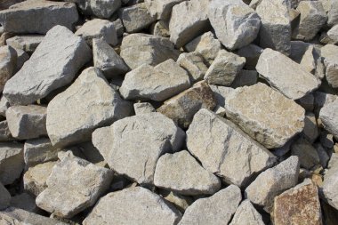 Yerdeki gri taşların dokusu, yakın plan.