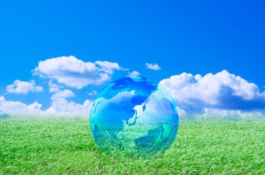 Yeşil çimenlerin üzerindeki dünya gezegeni, çevre koruma kavramı 