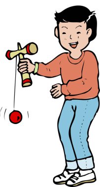 Gülümseyen çocuk içeride mutlu bir şekilde kendama oynuyor.