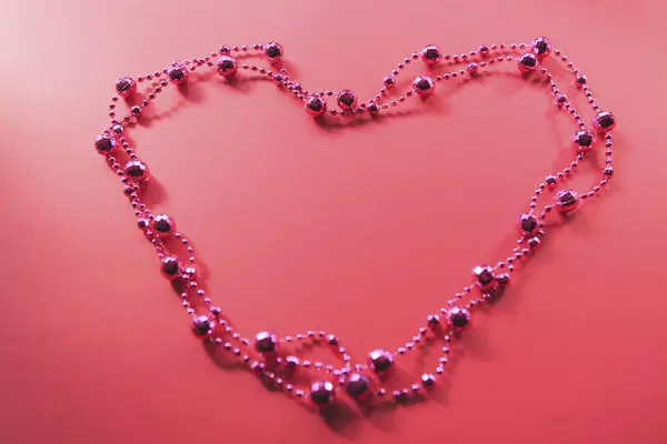 Corazón Brillante Sobre Fondo Rosa —  Fotos de Stock