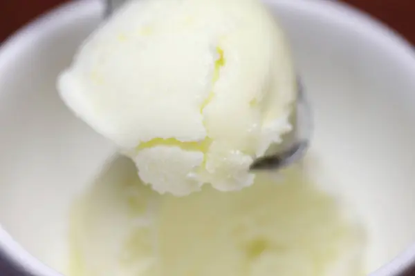vanilla ice cream in bowl on background, close up