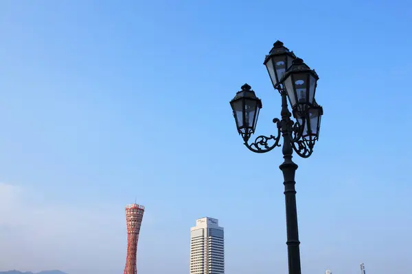 Black street lamp on blue sky background