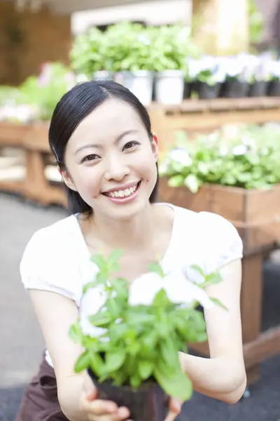 beautiful Japanese woman at flower shop