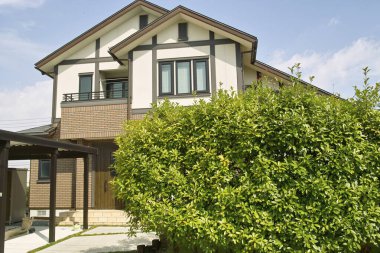 Köy evi cephesi, mülk inşaatı 