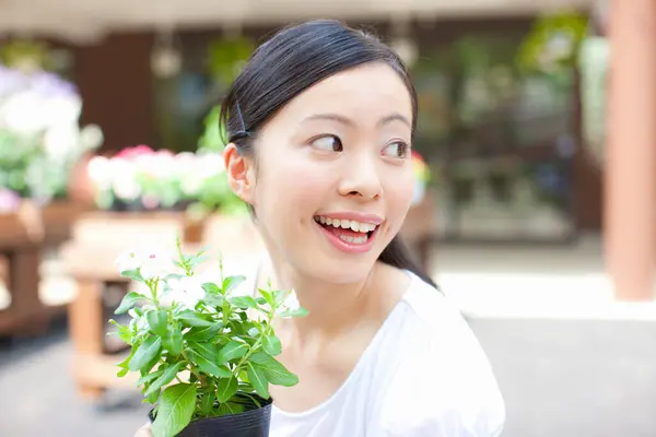beautiful Japanese woman at flower shop