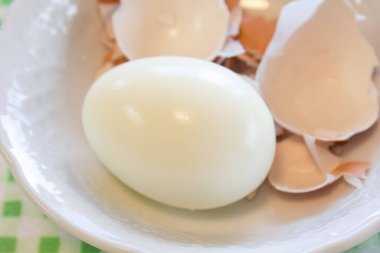 Showing boiled egg and shells