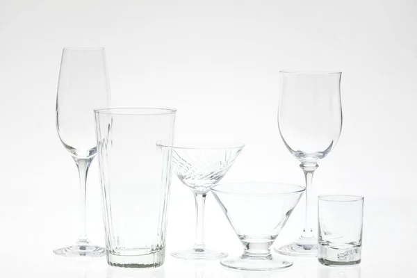 glass of water and empty glasses