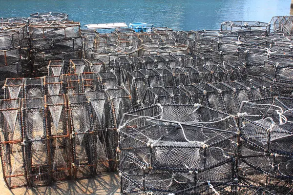 crab traps in port. stacked fishing nets