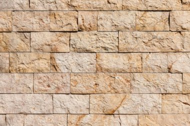 Arka planda taşlar olan tuğla duvar, kapat