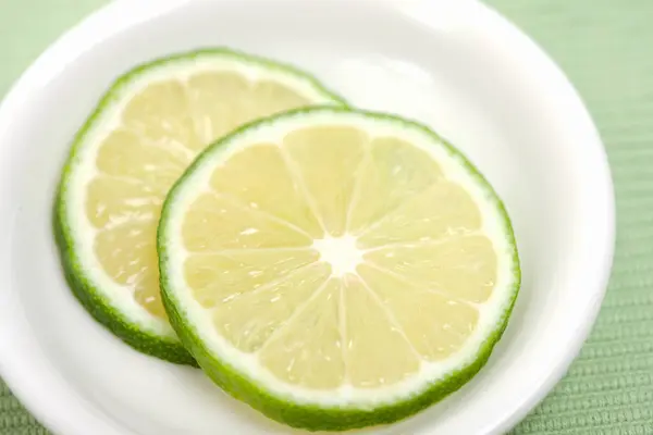Sliced Lime Isolated White Plate Background — Stock Photo, Image