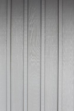 Gri ve beyaz desenli ahşap duvardan gri arkaplan.   