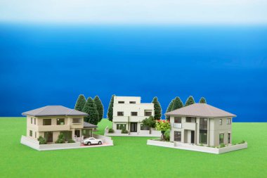 miniature houses models and green trees. real estate concept    