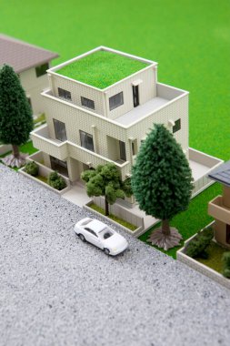 miniature houses models with green trees and lawn. real estate concept        