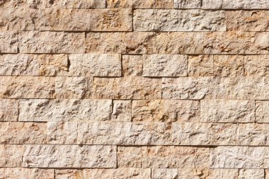 Arka planda taşlar olan tuğla duvar, kapat