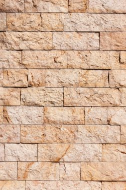 Arka planda taşlar olan tuğla duvar, kapat