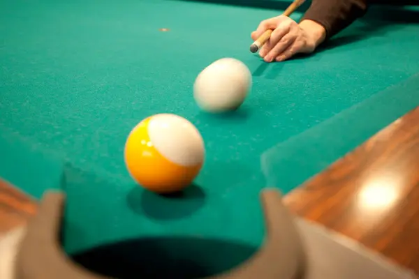 billiard game. a billiard table balls and cue