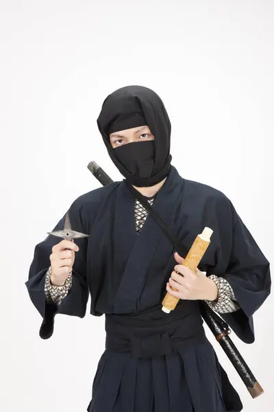 Young Man Ninja Costume Holding Star Rolled Paper — Stock Photo, Image