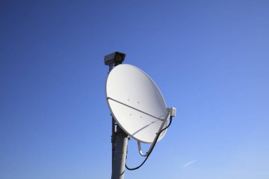 satellite dish antenna on blue sky background