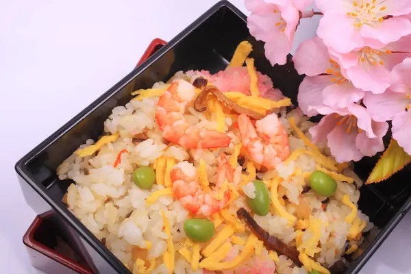 Japanese Cuisine Delicious Rice Shrimps Vegetables Pink Spring Blossoms Light — Stock Photo, Image