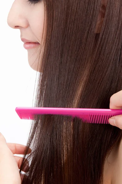 professional combing womans long hair