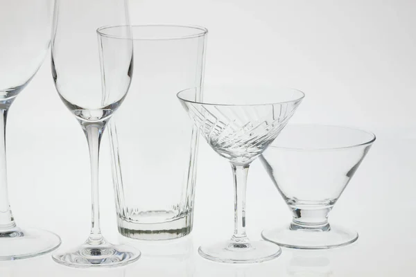 glasses and crystal glasses on a white background