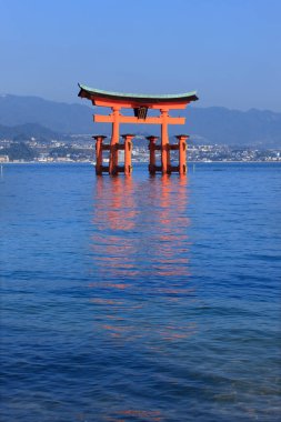 Miyajima, Hiroshima, Japan at the floating gate of Itsukushima Shrine clipart