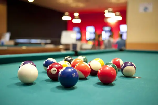 billiard game. a billiard table balls and cue
