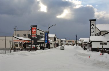 View of the snow-covered buildings at Matsumae town in Hokkaido, Japan clipart