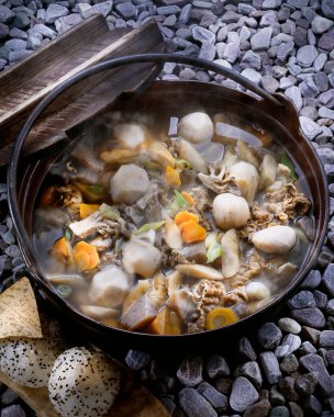 Cooking delicious soup with fresh vegetables