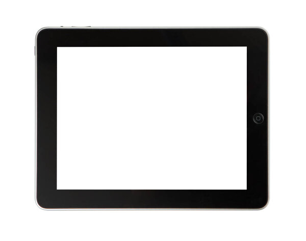 Top view of modern tablet device on wooden table background