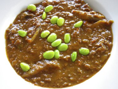 Serving delicious lentil curry dish