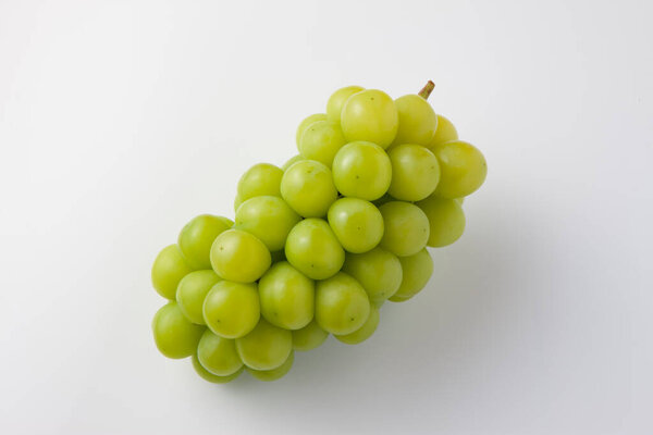 bunch of fresh ripe grapes on white background, close-up    