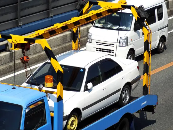 car tow truck with yellow crane