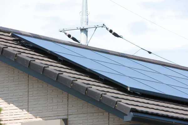 solar panels on roof of building, alternative energy
