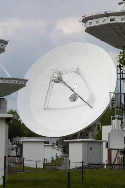 stock image satellite dish on blue sky background