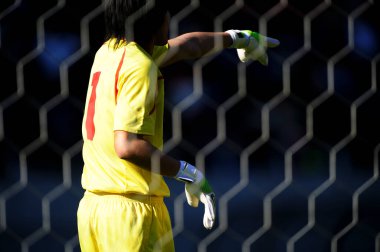 Asyalı futbolcuların yan görünümü 