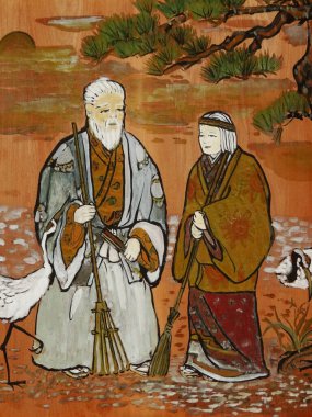 Geleneksel Japon sanat eserleri, yaşlı bir çifti, bir çam ağacının altında, vinçlerin yanında dikilirken gösteriyor..