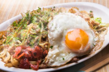 Serving delicious fried noodles with egg