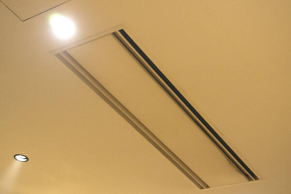 close up view of the modern lamp on a ceiling