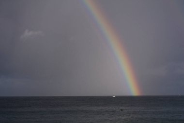 a rainbow in the sea
