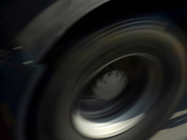 car tire close up, blurred motion view