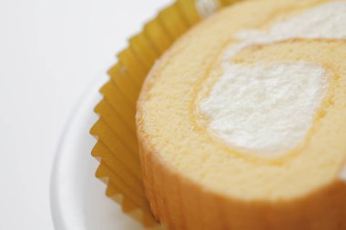 Arkaplanda lezzetli, tatlı vanilyalı rulo