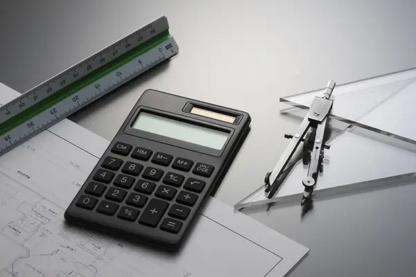 architect, calculator, ruler, pen and calculator on white background