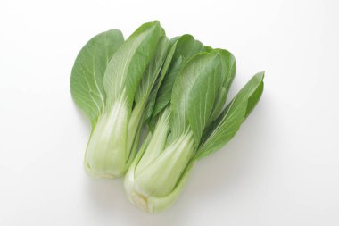 fresh green pak choi cabbage isolated on white background clipart
